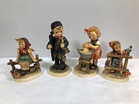 Group shot of all four Goebel Hummel figurines
