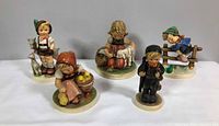 Group shot of all five Goebel Hummel figurines