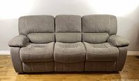 Front view of gray microfiber three-seat sofa
