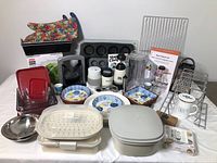 Full lot overview of kitchen tools, bakeware, storage and tableware