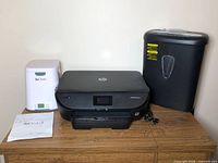 Overall lot showing SoClean2 unit, HP printer, Amazon Basics shredder, and SoClean2 manual