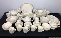 Full set of Tea Rose dinnerware and serveware displayed