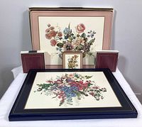 Overall lot showing placemats in two patterns and three coaster sets in original boxes