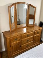 Full view dresser with tri-fold mirror attached