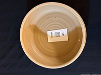 Top view of beige ceramic bowl interior