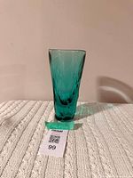 Full view of turquoise glass vase showing colour and shape
