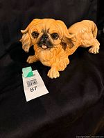 Front left view of Goebel tan ceramic Pekinese dog figurine