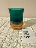 Full view of cup showing teal top and amber base