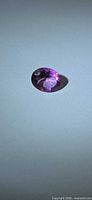Top view of the hot pink oval topaz loose stone