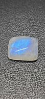 Front view of cushion cabochon moonstone showing blue flash