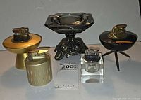 Group view of all four table lighters and ashtray