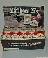 Front view of open Marlboro 25's display showing matchboxes