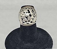Front view of sterling silver filigree dome ring on display stand