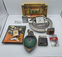 Group shot showing all ashtrays, lighters and tape measure