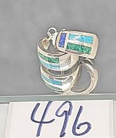 Pair of sterling hoop earrings showing inlay detail and stamp area