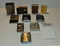 Group shot of all nine match safes and lighters