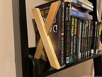 Shelf showing books and left bookend