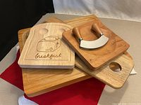 Group shot of all four boards stacked with mezzaluna on top