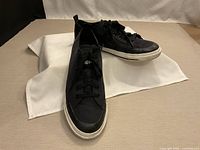 Three-quarter view of both shoes showing uppers and soles