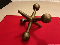 Front angle of cast metal jack showing form and finish