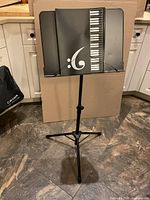 Full view of CAHAYA music stand with tray and carry bag