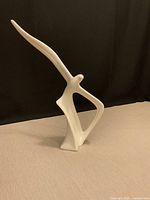 Front angled view of entire white ceramic seagull sculpture