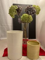 three vases and hydrangeas grouped