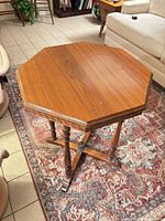 Full view of octagonal wooden side table top and legs