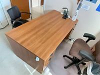 Top and side view of laminate executive desk showing surface finish and attached pedestal