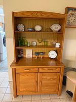 Front view of Oregon pine hutch with shelves and displayed items
