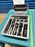 entire lot showing loaf pan, baker, flatware in organizer