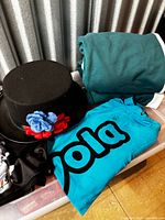 Crayola shirt, rolled teal tracksuit, skeleton shirt corner, top hat