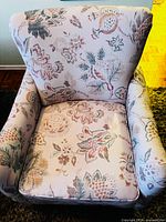 Front view of floral upholstered armchair