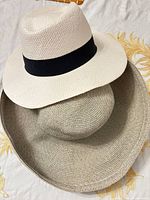 Two hats stacked showing overall design and colours