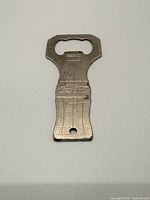 Front view of embossed Coca-Cola bottle opener
