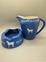 pitcher and ashtray front view showing color and graphics