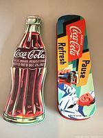 Closed view of both tins, bottle shape and retro rectangular