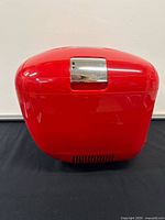 Front view of red Coca-Cola mini fridge
