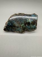 Front view showing polished face with labradorescence