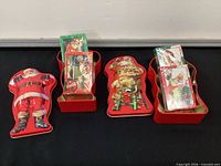 All items: two tins with four sealed card decks displayed