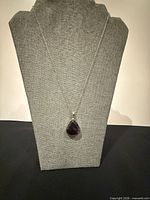 Full view of necklace on display form