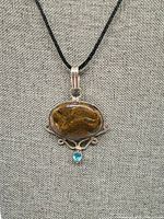 Full view of pendant on display stand with cord