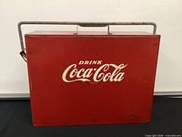 Front view showing red cooler with white Coca-Cola logo