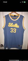Front view of Adidas UCLA jersey showing color, script and number