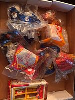 Group of sealed Happy Meal toys inside box