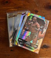 Stack of UFC Chrome cards with Jon Jones refractor on top