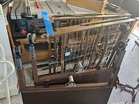 Both folded trundle bed frames showing spring bases, legs and wheels