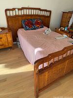 Full view of assembled adjustable bed with wood headboard and footboard