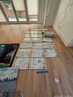All framed map panels arranged on floor