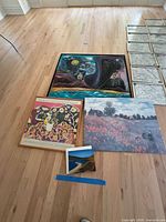 Group shot of all artwork laid out on floor